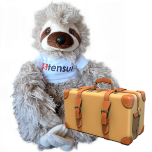 Speedy the Stensul sloth with a suitcase ready to travel the world