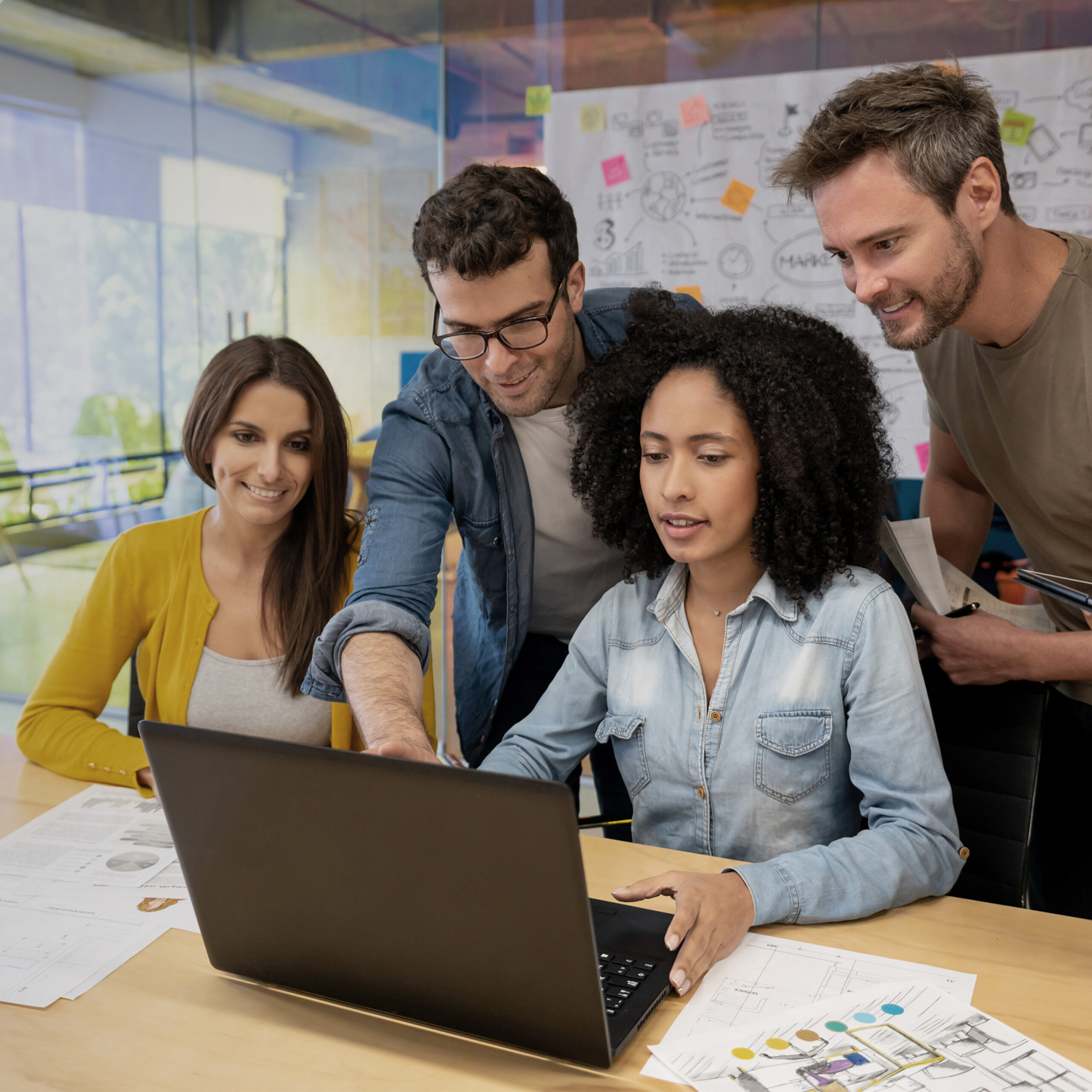 group of marketers seeing the benefits of a marketing creation platform on a computer screen