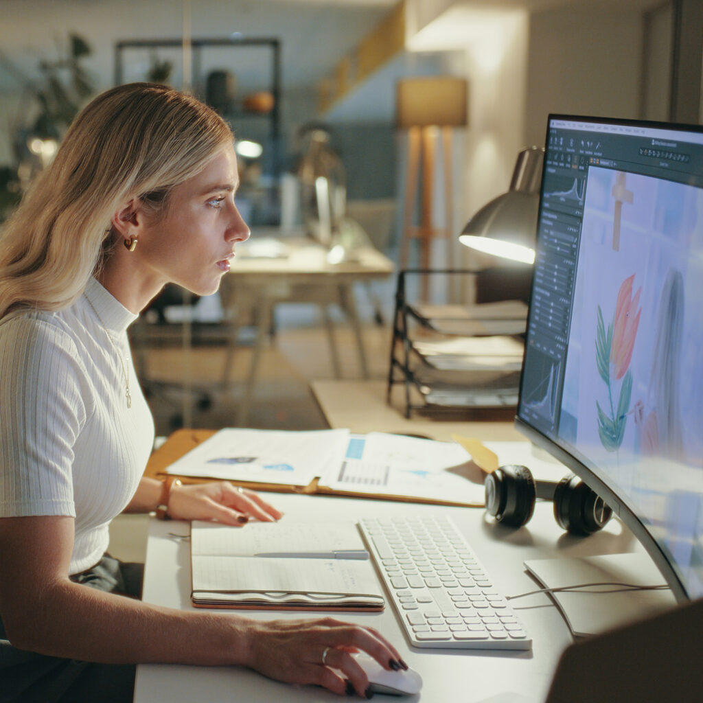 Woman designer working at a computer on an email design