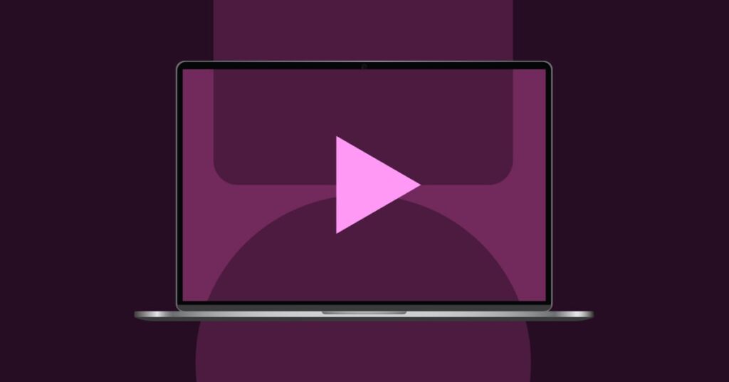 Laptop with a play button and abstract shapes