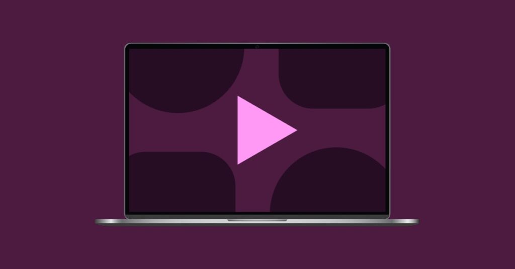 Laptop with a play button and abstract shapes