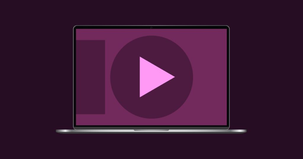 Laptop with a play button and abstract shapes