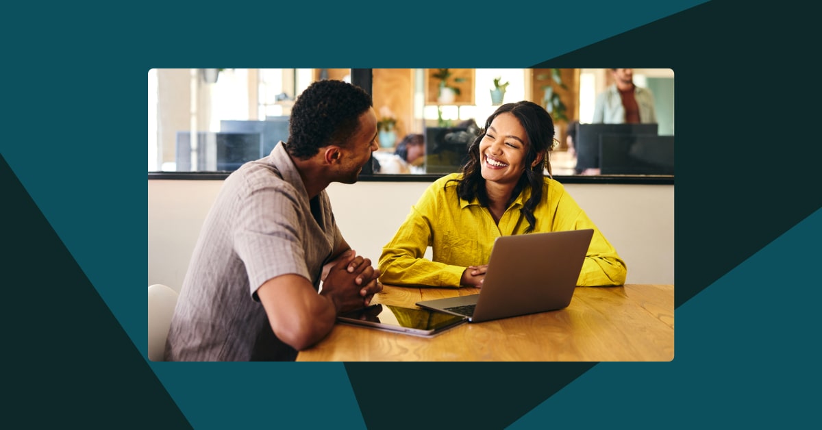 Two people in an office working together