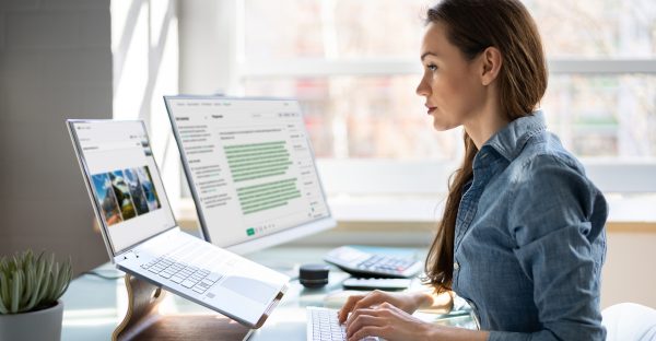 woman typing on a laptop