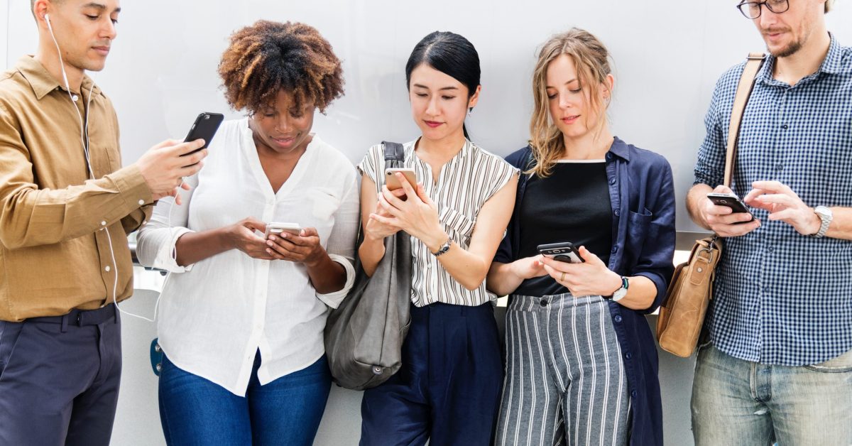 diverse group of people reading email on their mobile devices