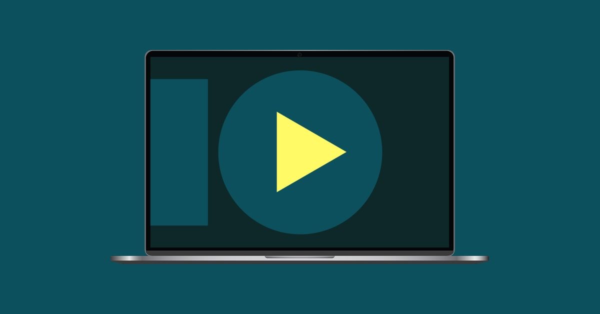 Laptop with a play button and abstract shapes