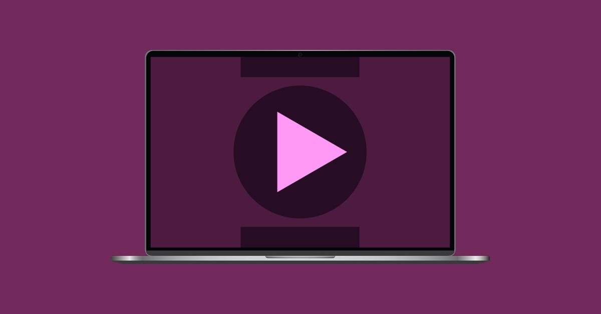 Laptop with a play button and abstract shapes