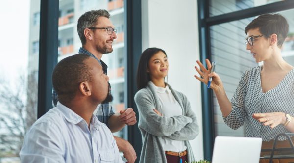 Work team discussing email creation