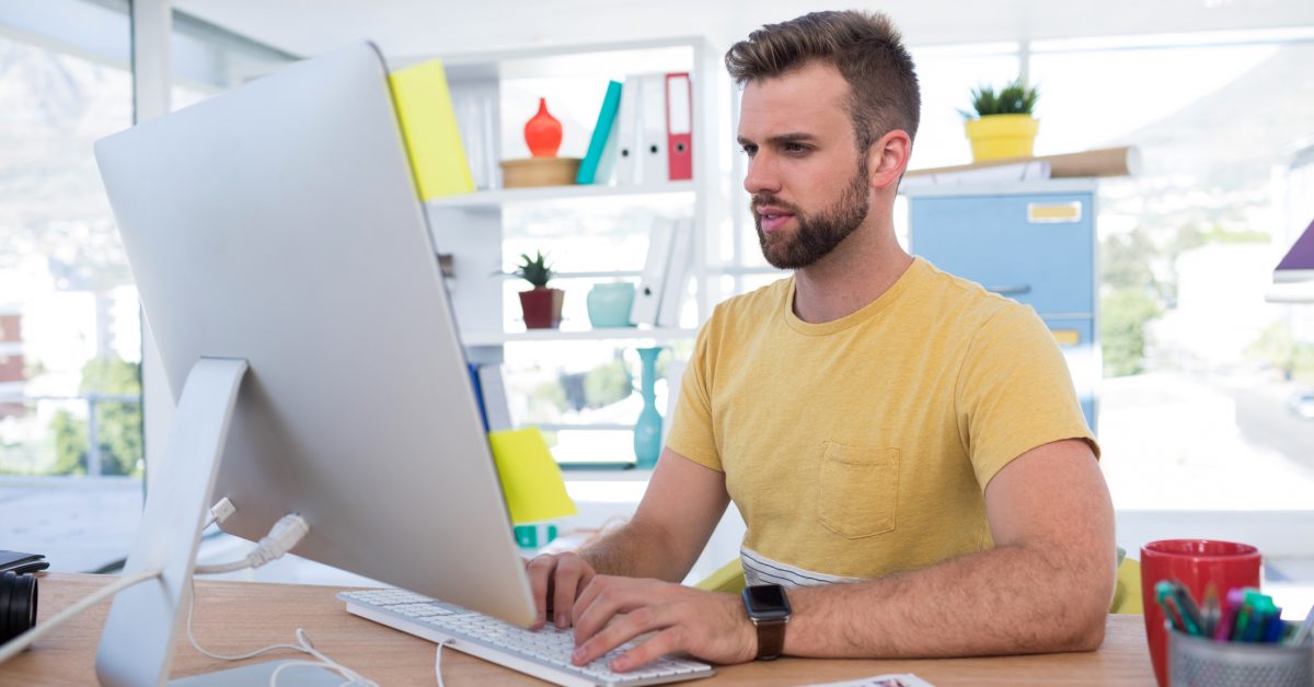 male graphics designer at computer