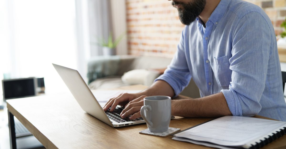 Man working on a laptop in the home office