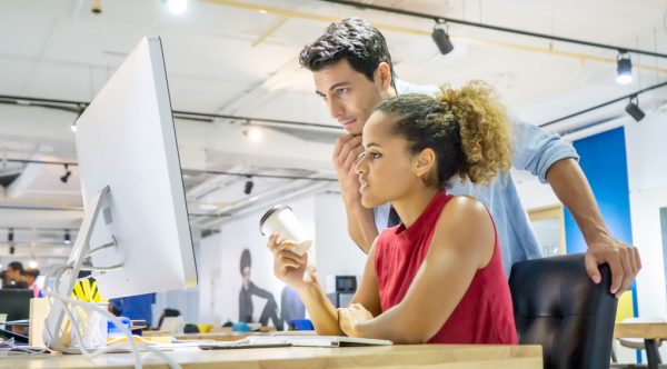 man and woman working at desk