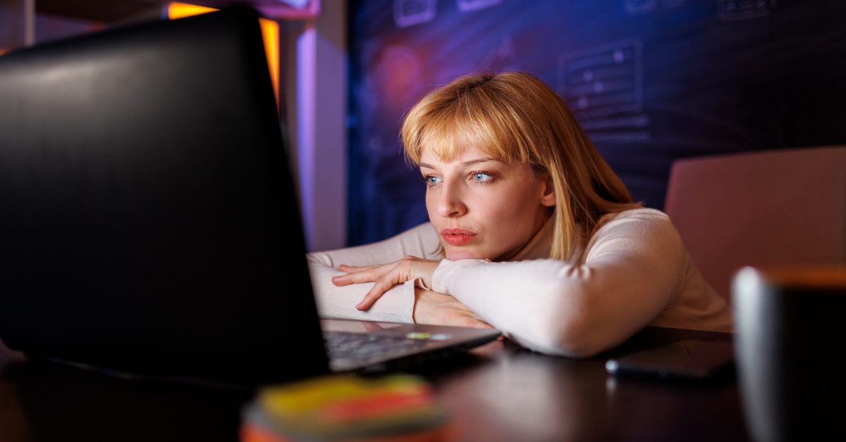 woman marketing manager looking at computer display